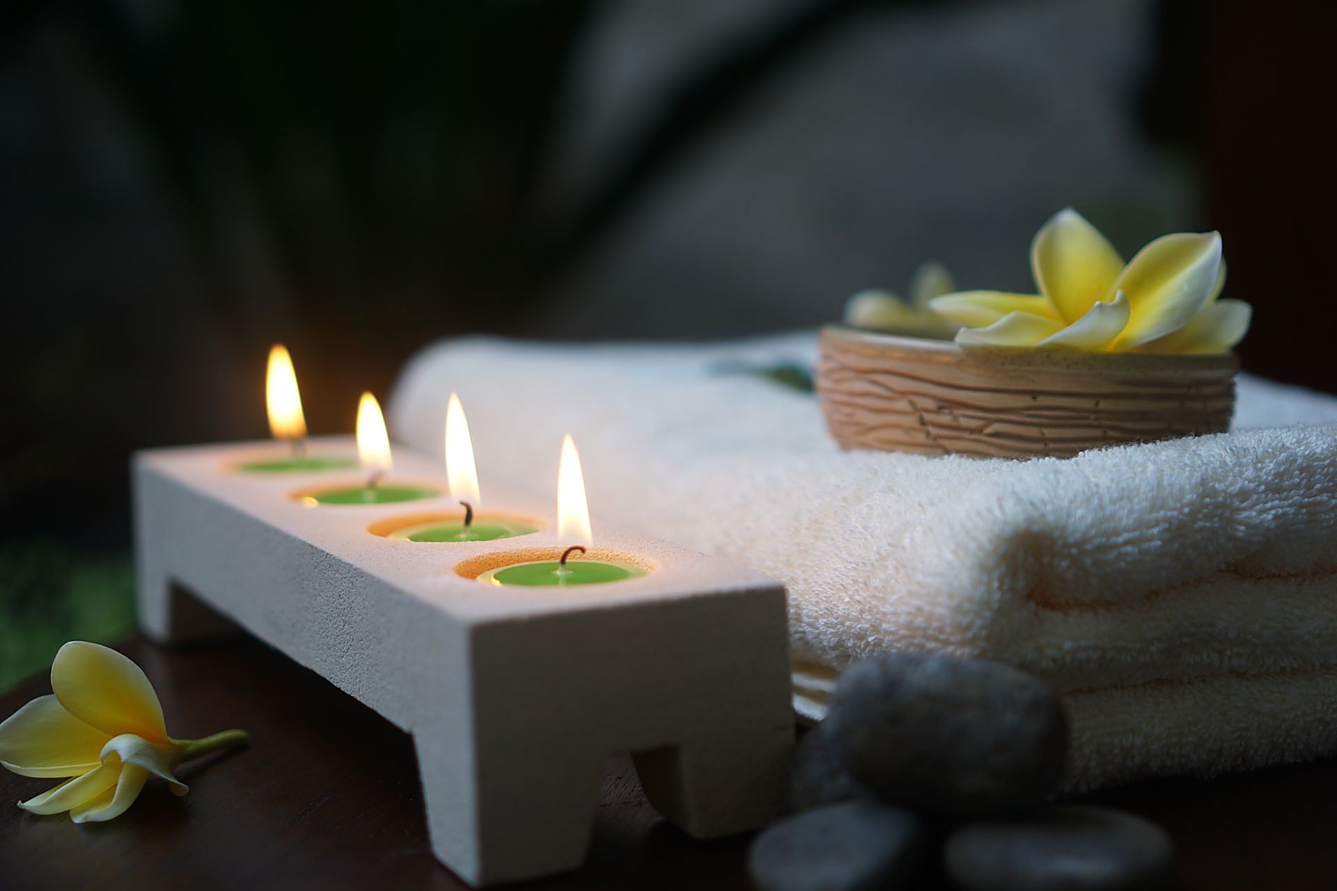 Calm spa setting with candles and flowers
